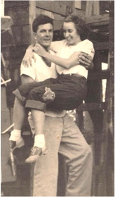 Dad carries Mom across threshold